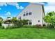 Expansive backyard view with a peek at the gazebo surrounded by well-manicured grass and greenery at 9001 Harrison Run Ct, Indianapolis, IN 46256
