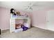 Bright bedroom featuring a unique loft bed with a playful design and a ceiling fan at 9001 Harrison Run Ct, Indianapolis, IN 46256