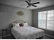 Cozy bedroom with ceiling fan, natural light, and neutral decor at 9106 Hedley E Way, Avon, IN 46123