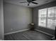 Bedroom featuring neutral walls, dark flooring and a large window with blinds at 9106 Hedley E Way, Avon, IN 46123