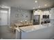 Open kitchen and dining area featuring stainless steel appliances and quartz countertop bar at 9106 Hedley E Way, Avon, IN 46123