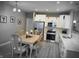 Modern kitchen featuring white cabinets, hardwood floors, and stainless steel appliances at 9106 Hedley E Way, Avon, IN 46123
