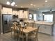 Eat-in kitchen with white cabinets, stainless steel appliances, and granite countertops at 9106 Hedley E Way, Avon, IN 46123