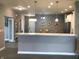 Open kitchen with breakfast bar offering seamless flow to the dining and living areas at 9106 Hedley E Way, Avon, IN 46123