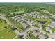 Aerial view of a well-planned community featuring a pond, lush greenery, and nicely landscaped yards at 9656 Summerton Dr, Fishers, IN 46037