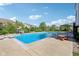 Backyard pool with a slide, diving board, picnic table and patio, perfect for summer fun at 9656 Summerton Dr, Fishers, IN 46037