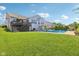 Spacious backyard with a pool and deck, offering a relaxing outdoor living space and a play area at 9656 Summerton Dr, Fishers, IN 46037