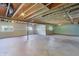 Spacious unfinished basement with exposed ceiling, concrete floors and natural light from multiple windows at 9656 Summerton Dr, Fishers, IN 46037
