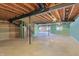 Unfinished basement area featuring exposed ceiling, concrete floor, utility pipes and natural light from multiple windows at 9656 Summerton Dr, Fishers, IN 46037