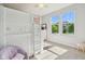 Bright bedroom features a built-in bunk bed, soft carpeting, and two windows offering a sunny view at 9656 Summerton Dr, Fishers, IN 46037