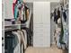 Walk-in closet with custom built-in shelves and storage, providing ample space for clothes and accessories at 9656 Summerton Dr, Fishers, IN 46037