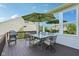 Outdoor deck featuring a glass table with umbrella, along with a grill, perfect for entertaining guests at 9656 Summerton Dr, Fishers, IN 46037