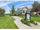 Charming home with manicured lawn, and information kiosk along sidewalk at 9656 Summerton Dr, Fishers, IN 46037