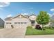 Charming home featuring a beautifully landscaped yard and a three-car garage, plus a stone-accented facade at 9656 Summerton Dr, Fishers, IN 46037