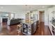 Gourmet kitchen with island seating, stainless steel appliances, and seamless flow to living areas at 9656 Summerton Dr, Fishers, IN 46037