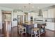 Modern kitchen with granite counters, stainless appliances, and a center island with seating at 9656 Summerton Dr, Fishers, IN 46037