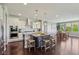Open kitchen boasts a large island, stainless steel appliances, and modern finishes at 9656 Summerton Dr, Fishers, IN 46037