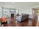 Bright and airy living room featuring a cozy fireplace, stylish decor, and rich hardwood floors at 9656 Summerton Dr, Fishers, IN 46037