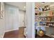 Walk-in pantry with ample shelving offers an abundance of storage at 9656 Summerton Dr, Fishers, IN 46037