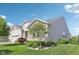A well-manicured lawn and landscaping surround this home's exterior, accentuating the attractive architecture at 9656 Summerton Dr, Fishers, IN 46037