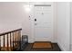 Cozy entryway with a shoe rack, a patterned doormat, and a well-lit doorway to unit 303 at 970 Fort Wayne Ave # 303, Indianapolis, IN 46202