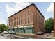 Classic red brick building featuring traditional architecture and inviting commercial and residential spaces at 970 Fort Wayne Ave # 303, Indianapolis, IN 46202