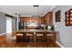 A kitchen with granite countertops, wooden barstools, and stainless steel appliances at 970 Fort Wayne Ave # 303, Indianapolis, IN 46202