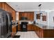 Modern kitchen with stainless steel appliances, granite countertops, and ample cabinet space at 970 Fort Wayne Ave # 303, Indianapolis, IN 46202