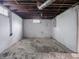 Unfinished basement with painted walls and exposed ductwork offers potential for customization and additional living space at 1065 36Th St, Indianapolis, IN 46208