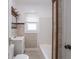 Bathroom with tiled walls, vanity, and bathtub at 1065 36Th St, Indianapolis, IN 46208