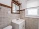 Bathroom with tiled walls, vanity, and window at 1065 36Th St, Indianapolis, IN 46208