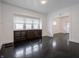 Bright dining room with dark hardwood floors and a large built-in cabinet for ample storage at 1065 36Th St, Indianapolis, IN 46208