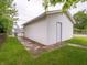 View of a white, detached garage situated in a grassy backyard at 1065 36Th St, Indianapolis, IN 46208