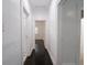 Hallway with hardwood floors leading to multiple rooms at 1065 36Th St, Indianapolis, IN 46208