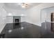Spacious living room features gleaming dark hardwood floors, fireplace, built-in shelves, and ample natural light at 1065 36Th St, Indianapolis, IN 46208