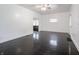 Bright living room featuring dark hardwood floors, fresh white walls, and abundant natural light from multiple windows at 1065 36Th St, Indianapolis, IN 46208