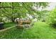 Backyard featuring a spacious deck ideal for outdoor entertaining, with plenty of green space at 1106 W 4Th St, Anderson, IN 46016