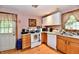 Functional kitchen with light cabinets and hardwood floors at 1106 W 4Th St, Anderson, IN 46016