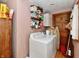 Laundry room featuring a washer, dryer, and storage shelves at 1106 W 4Th St, Anderson, IN 46016