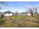 A spacious backyard with a wooden fence and small storage shed on a clear day at 1216 N Ewing St, Indianapolis, IN 46201