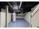 Basement featuring painted floors and walls, water heater, and exposed ductwork at 1216 N Ewing St, Indianapolis, IN 46201