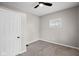 This bedroom features neutral paint, new carpet, a ceiling fan and natural light from the window at 1216 N Ewing St, Indianapolis, IN 46201