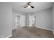 A carpeted bedroom with an open doorway to another room and an additional doorway to the left at 1216 N Ewing St, Indianapolis, IN 46201