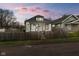 Charming home featuring a fenced yard, neutral paint and inviting curb appeal at 1216 N Ewing St, Indianapolis, IN 46201