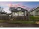 Charming single-story home featuring a fenced yard, neutral paint and inviting curb appeal at 1216 N Ewing St, Indianapolis, IN 46201