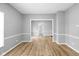 Spacious living room featuring gray walls and beautiful hardwood flooring at 1216 N Ewing St, Indianapolis, IN 46201