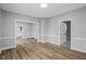 Spacious living room featuring gray walls and beautiful hardwood flooring at 1216 N Ewing St, Indianapolis, IN 46201