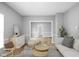 Living room featuring modern decor, gray walls and beautiful hardwood flooring at 1216 N Ewing St, Indianapolis, IN 46201