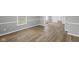 Living room featuring gray walls, white trim and beautiful hardwood flooring at 1216 N Ewing St, Indianapolis, IN 46201