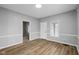 Living room featuring gray walls, white trim, and beautiful hardwood flooring at 1216 N Ewing St, Indianapolis, IN 46201